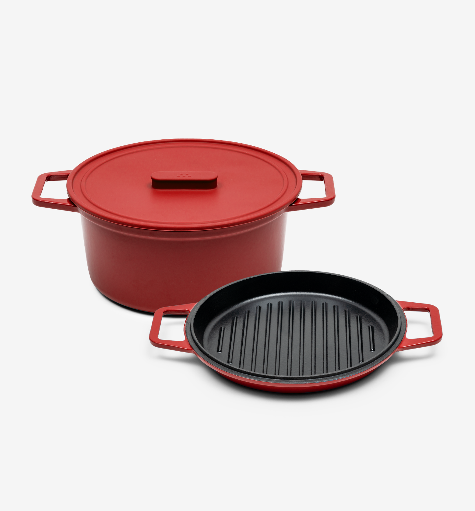 Red cast iron Dutch oven with lid and matching grill pan cookware set
